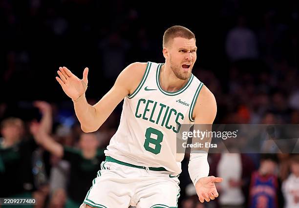 Kristaps Porzingis of the Boston Celtics reacts after his three point shot in overtime against the New York Knicks at Madison Square Garden on April...