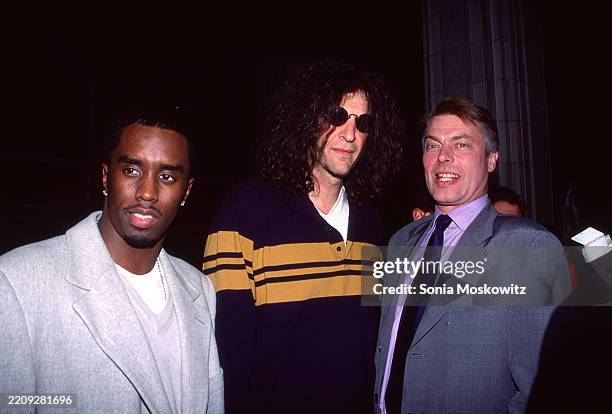 Sean Combs, Howard Stern and Richard Johnson attend a party for Page Six at Guastavino's Restaurant in New York City on December 13, 2000.