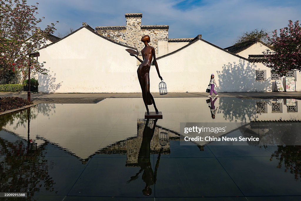 The shallow pool mirrors the ancient building outline at the Qingguo ...