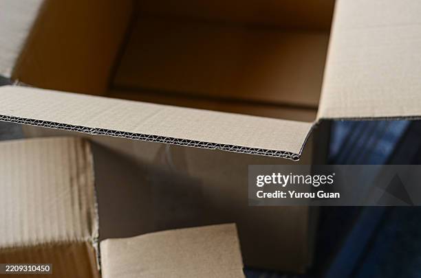 cardboard box stack - essential packaging solution.a stack of sturdy cardboard boxes, perfect for shipping, storage, and commercial packaging needs. these versatile containers feature crisp corrugated edges and clean surfaces, ideal for branding with logo - wellpapp bildbanksfoton och bilder