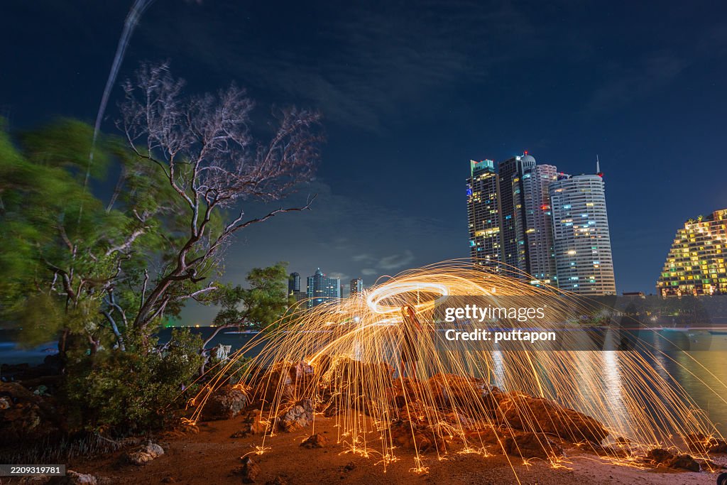 Creative light painting by burning steelwool