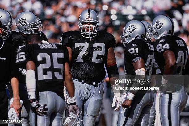 Portrait of Lincoln Kennedy, Right Tackle for the Oakland Raiders looking on from the huddle during the American Football Conference West game...