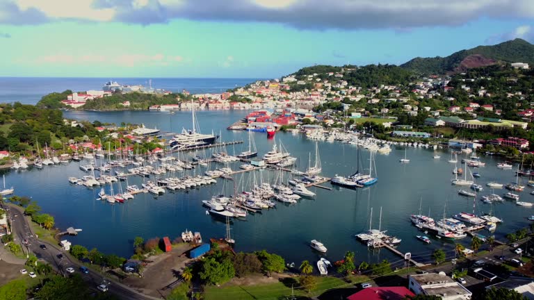 https://media.gettyimages.com/id/2209365274/video/establishing-marina-aerial-of-yachts-and-boats-in-saint-george-grenada-harbor.jpg?b=1&s=640x640&k=20&c=tJpOYwrBz5DUOafRR_P-YWWoCPs-FL8lZuC5WAeRumw=