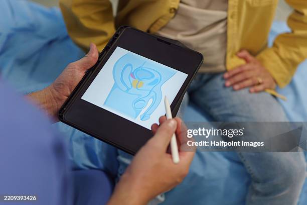 doctor discussing prostate health and urinary issues with patient. - prostate cancer stock pictures, royalty-free photos & images