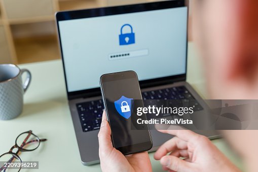 Programmer securing data with two-factor authentication using laptop and smartphone Programmer securing data with two-factor authentication using laptop and smartphone