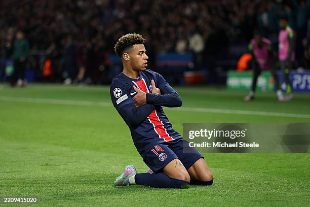 Desire Doue of Paris Saint-Germain celebrates scoring his team's first goal during the UEFA Champions League 2024/25 Quarter Final First Leg match...