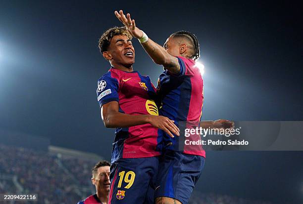 Lamine Yamal of FC Barcelona celebrates scoring his team's fourth goal with teammate Raphinha during the UEFA Champions League 2024/25 Quarter Final...