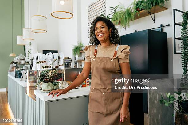 portrait of smiling coffee shop owner - smiling barista stock pictures, royalty-free photos & images