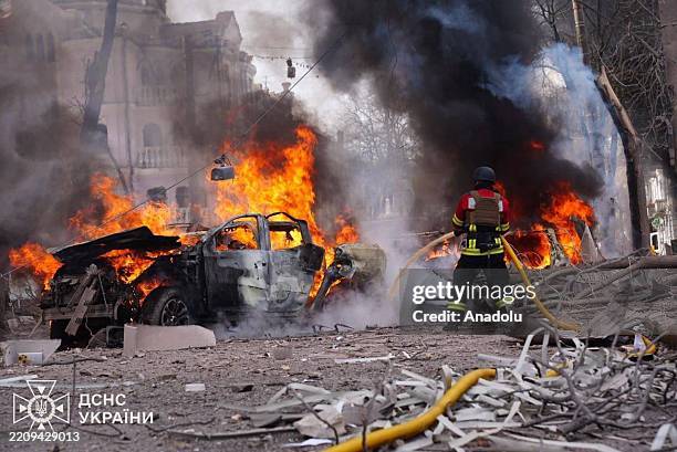 Firefighters continue to extinguish the cars fires following the Russian missile attack on Sumy, Ukraine on April 13, 2025. Ukraine said on Sunday...