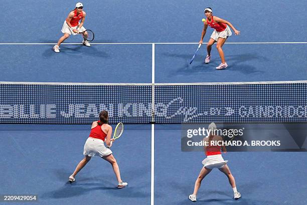 Japan's Shuko Aoyama and Ena Shibahara play a shot against Canada's Kayla Cross and Rebecca Marino during the women's doubles match between Japan and...