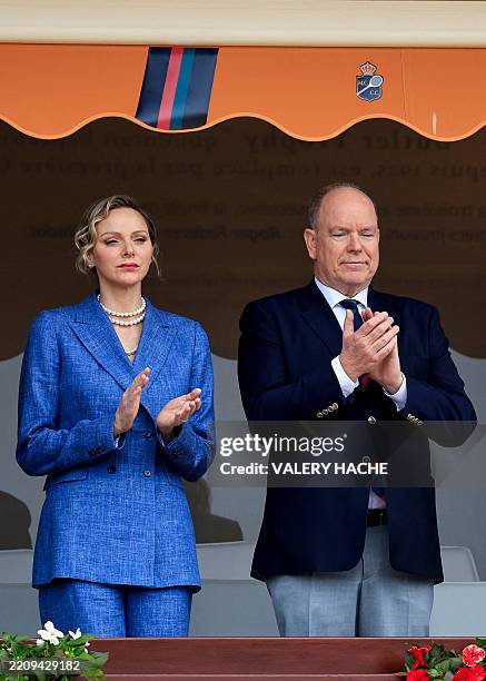 Prince Albert II of Monaco and Princess Charlene of Monaco applaud ahead of the Monte Carlo ATP Masters Series Tournament final tennis match at the...