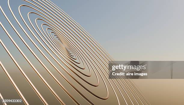 golden concentric circles creating a mesmerizing spiral against a clear sky - minimal art stockfoto's en -beelden