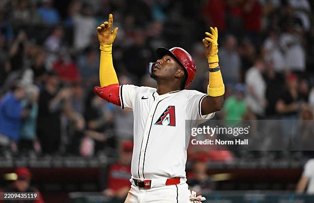 Geraldo Perdomo of the Arizona Diamondbacks celebrates after hitting a solo home run against the Baltimore Orioles during the eighth inning at Chase...