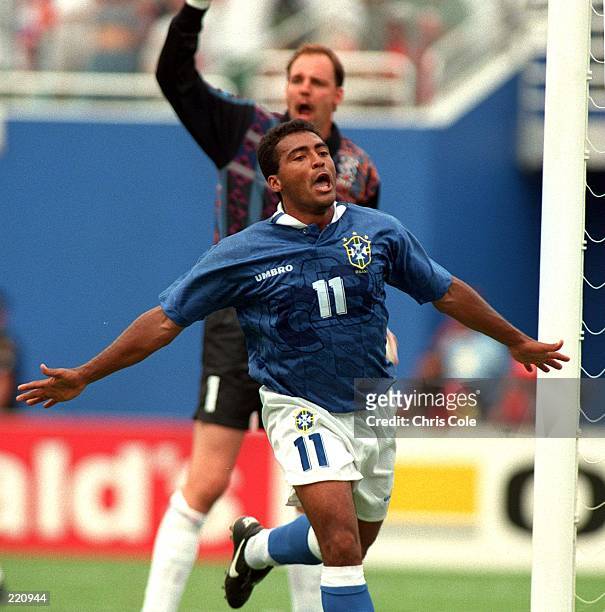 ROMARIO OF BRAZIL CELEBRATES AFTER SCORING THE OPENING GOAL AS DUTCH GOALKEEPER ED DE GOEJ APPEALS FOR AN OFF SIDE CALL DURING 1994 WORLD CUP FINALS...