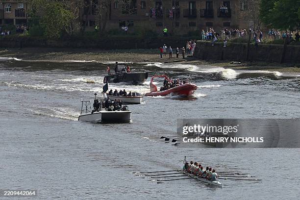 The Cambridge crew row to the finish line, beating Oxford in the 79th women's boat race between Oxford University and Cambridge University on the...