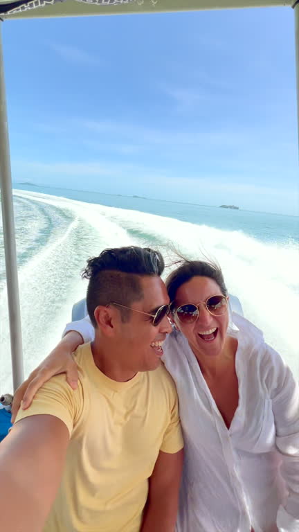 https://media.gettyimages.com/id/2209489929/video/couple-enjoying-a-speedboat-ride-on-a-sunny-day.jpg?b=1&s=640x640&k=20&c=FIC8srcgT8qtw9PgyJ-J0JW5i5wQKqTPBbYmjt_NMBo=