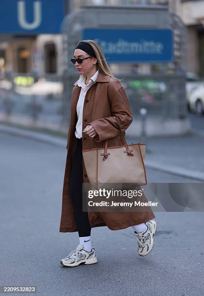 Sonia Lyson seen wearing black cotton headband, Corlin Eyewear slim oval-shaped dark brown sunglasses, Worst Behavior white cotton polo sweater...