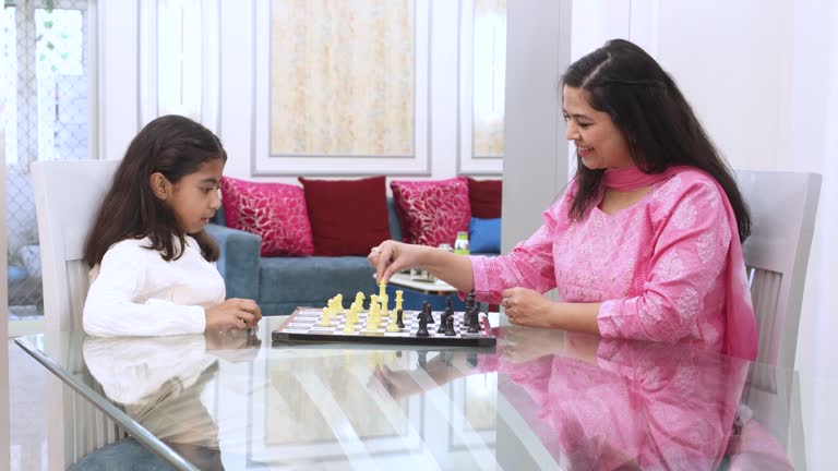 https://media.gettyimages.com/id/2209544386/video/young-indian-mother-and-child-daughter-play-chess-game-at-home-gild-kid-enjoy-indoor-sport.jpg?b=1&s=640x640&k=20&c=tL-2nu97VaORZXHoPYGmhybUUTpSLKgC09Fj6WMRGPA=