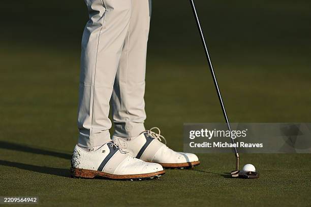 Detailed view of the golf shoes of Cameron Young of the United States on the second green during the first round of the 2025 Masters Tournament at...