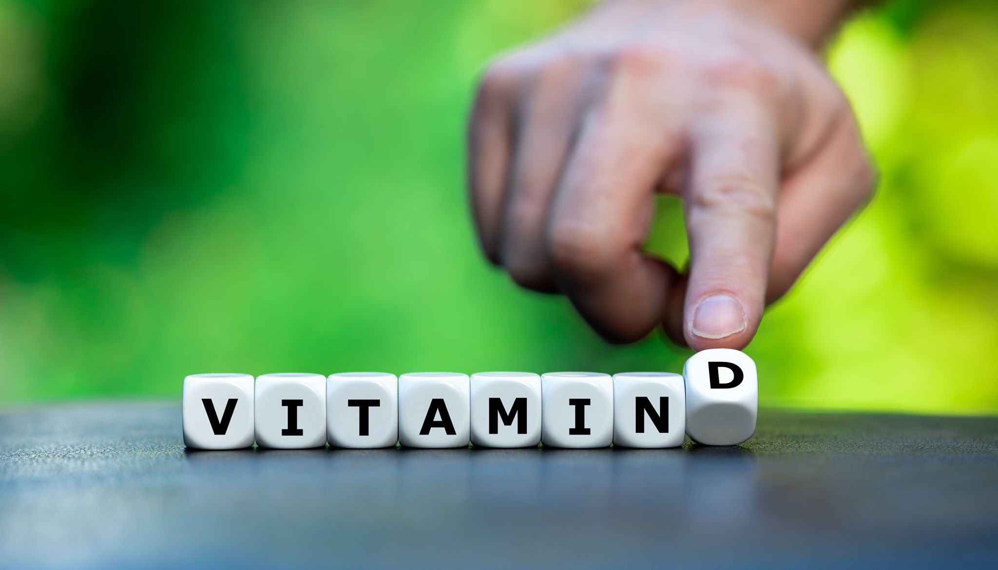 Dice form the expression 'Vitamin D'. Dice form the expression 'Vitamin D'.