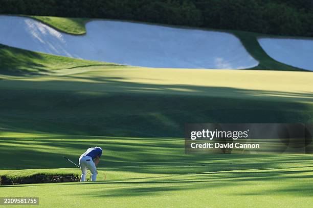 Rory McIlroy of Northern Ireland reacts to his third shot on the 13th hole during the final round of the 2025 Masters Tournament at Augusta National...