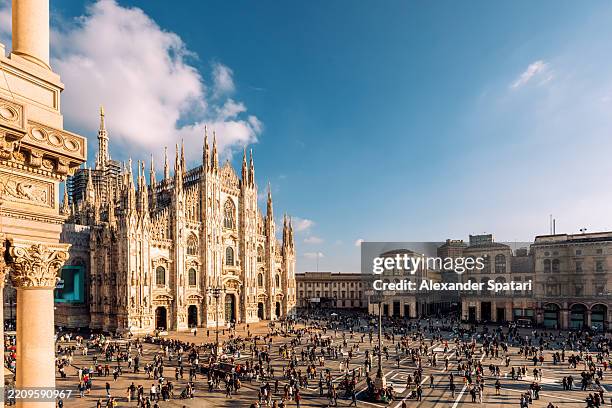 duomo di milano cathedral and piazza del duomo square on a sunny day, aerial view, milan, italy - milan stock pictures, royalty-free photos & images