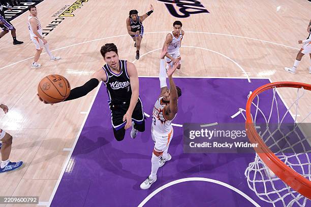 Doug McDermott of the Sacramento Kings drives to the basket during the game against the Phoenix Suns on April 13, 2025 at Golden 1 Center in...