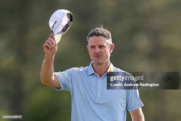 Justin Rose of England reacts after finishing the 18th hole during the first round of the 2025 Masters Tournament at Augusta National Golf Club on...
