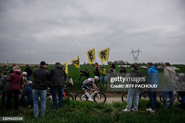 Dutch Rider Alpecin-Deceuninck's Dutch rider Mathieu van der Poel cycles past ...