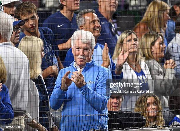 Kansas City Royals owner John Sherman applauds as Kansas City Royals pitcher Brady Singer closes out the seventh inning during Game 3 of the American...