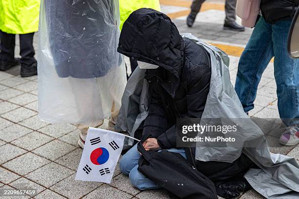 Supporter of former President Yoon Suk-yeol prays for his acquittal outside the Seoul Central District Court in Seocho District, Seoul, South Korea,...