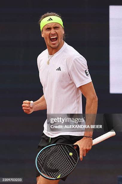 Germany's Alexander Zverev celebrates as he plays against France's Alexandre Muller during their men's singles match of the ATP Munich Open tennis...