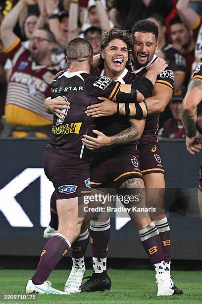 Reece Walsh of the Broncos celebrates a try with team mates during the round six NRL match between Brisbane Broncos and Sydney Roosters at Suncorp...