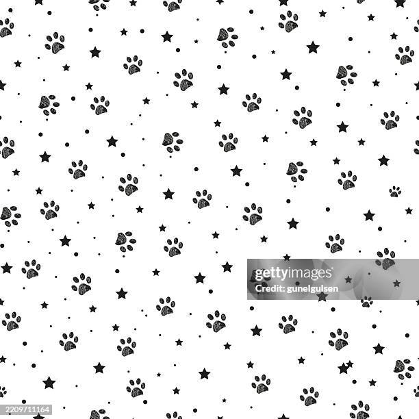 seamless fabric pattern with paw and stars - paw print pattern stock illustrations