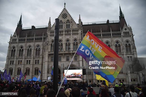 An LMBT+ flag is at a rally in front of the Hungarian Parliament in Budapest, Hungary, on April 14. The protests erupt after the parliament passes...