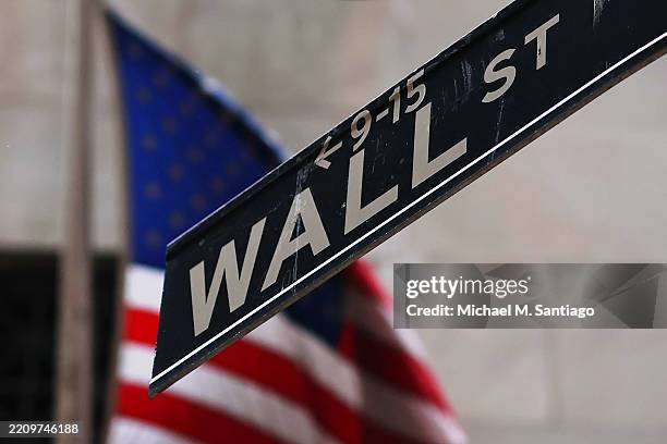 The Wall Street street sign is seen outside of the New York Stock Exchange during morning trading on April 11, 2025 in New York City. Stocks...