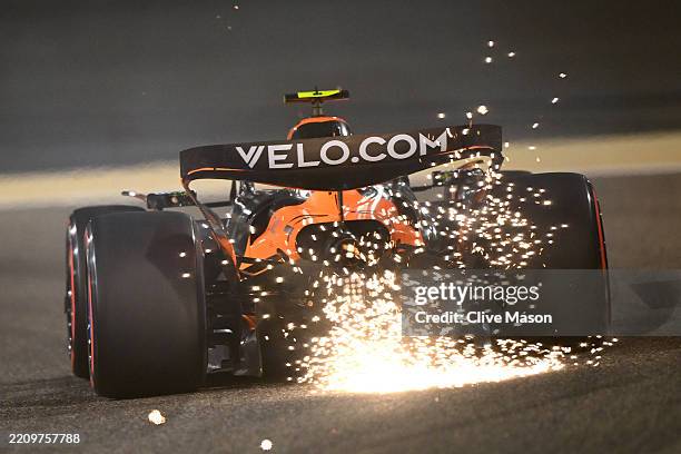 Sparks fly behind Lando Norris of Great Britain driving the McLaren MCL39 Mercedes on track during practice ahead of the F1 Grand Prix of Bahrain at...