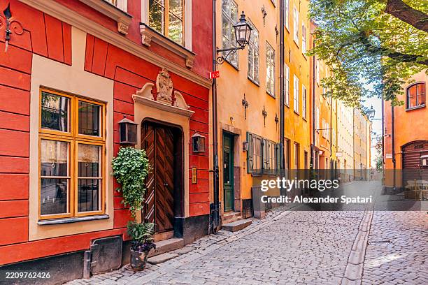 colourful streets of gamla stan - stockholm old town, sweden - stockholm stock-fotos und bilder