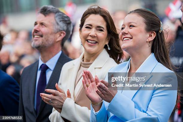 King Frederik X of Denmark, Queen Mary of Denmark and Princess Isabella of Denmark, watching a birthday surprise unfolding in front of Aarhus City...