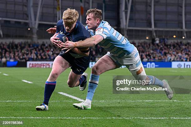 Tommy O'Brien of Leinster dives in to score his team's fourth try whilst under pressure from Stafford McDowall of Glasgow Warriors during the...