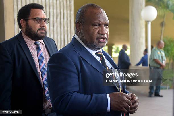 Papua New Guinea's Prime Minister James Marape leaves Parliament house after an unsuccessful no-confidence vote against him in Port Moresby on April...