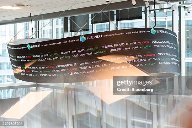Trading data on a digital board at the Euronext NV stock exchange in Paris, France, on Tuesday, April 15, 2025. Stocks rose as US President Donald...
