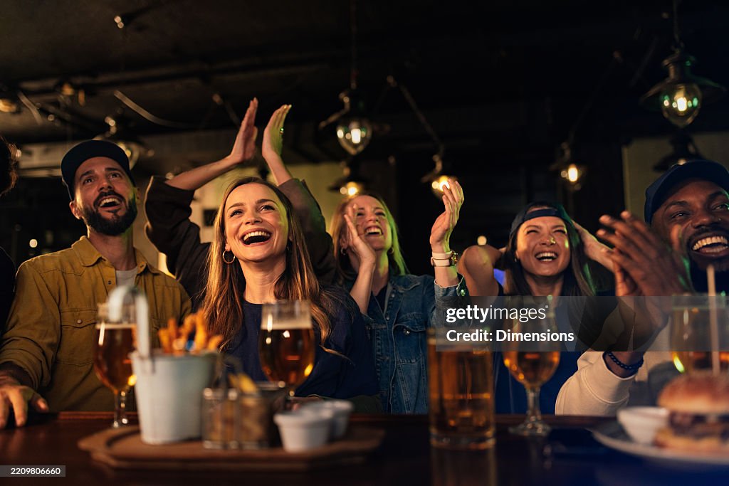 Freinds Clapping Enthusiastic Friends Clapping And Laughing Enjoying A Night Out At The ...