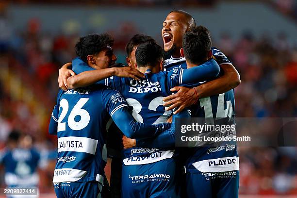 Arturo Gonzalez of Pachuca celebrates with teammates after scoring his team's fourth goal during the 15th round match between Necaxa and Pachuca as...