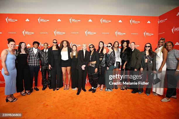 Huskies women's basketball team pose for a photo on the orange carpet during the 2025 WNBA Draft on April 14, 2025 at The Shed in New York, New York...