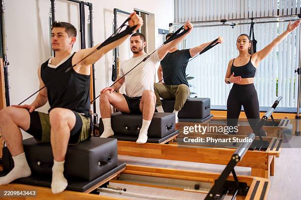 men pilates class - core training stock pictures, royalty-free photos & images