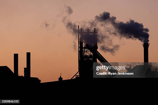 Smoke rises from towers at the British Steel Scunthrope Site on April 12, 2025 in Scunthorpe, England. Parliamentarians are recalled to the House of...