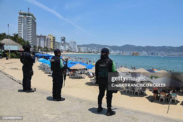 State police officers patrol a beach as part of a security operation to prevent criminal acts in the face of a wave of violence and protect tourists...