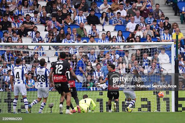 Alex Remiro of Real Sociedad fails to make a save as Sergi Darder of RCD Mallorca scores his team's second goal during the LaLiga match between Real...