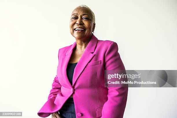 portrait of beautiful senior woman with short hair on white background - three quarter length stock pictures, royalty-free photos & images